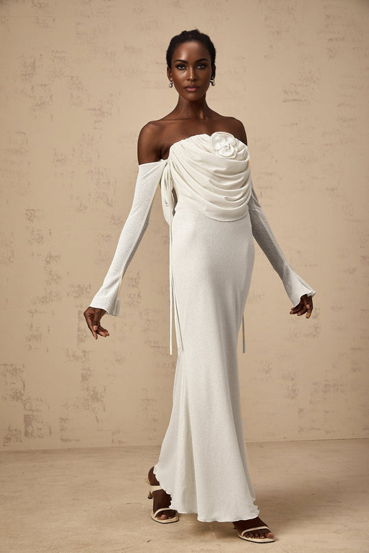 A long strapless maxi dress with a ruched bodice featuring colorful floral appliques in a Julia style design