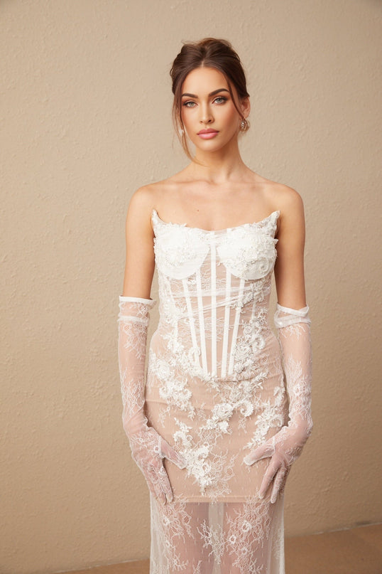 A long tulle maxi dress with a corset bodice featuring delicate floral embroidery named Mila The dress has a romantic and ethereal appearance