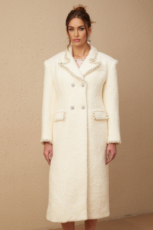A long tweed coat in wool with faux pearl embellishments featuring the Isotta design