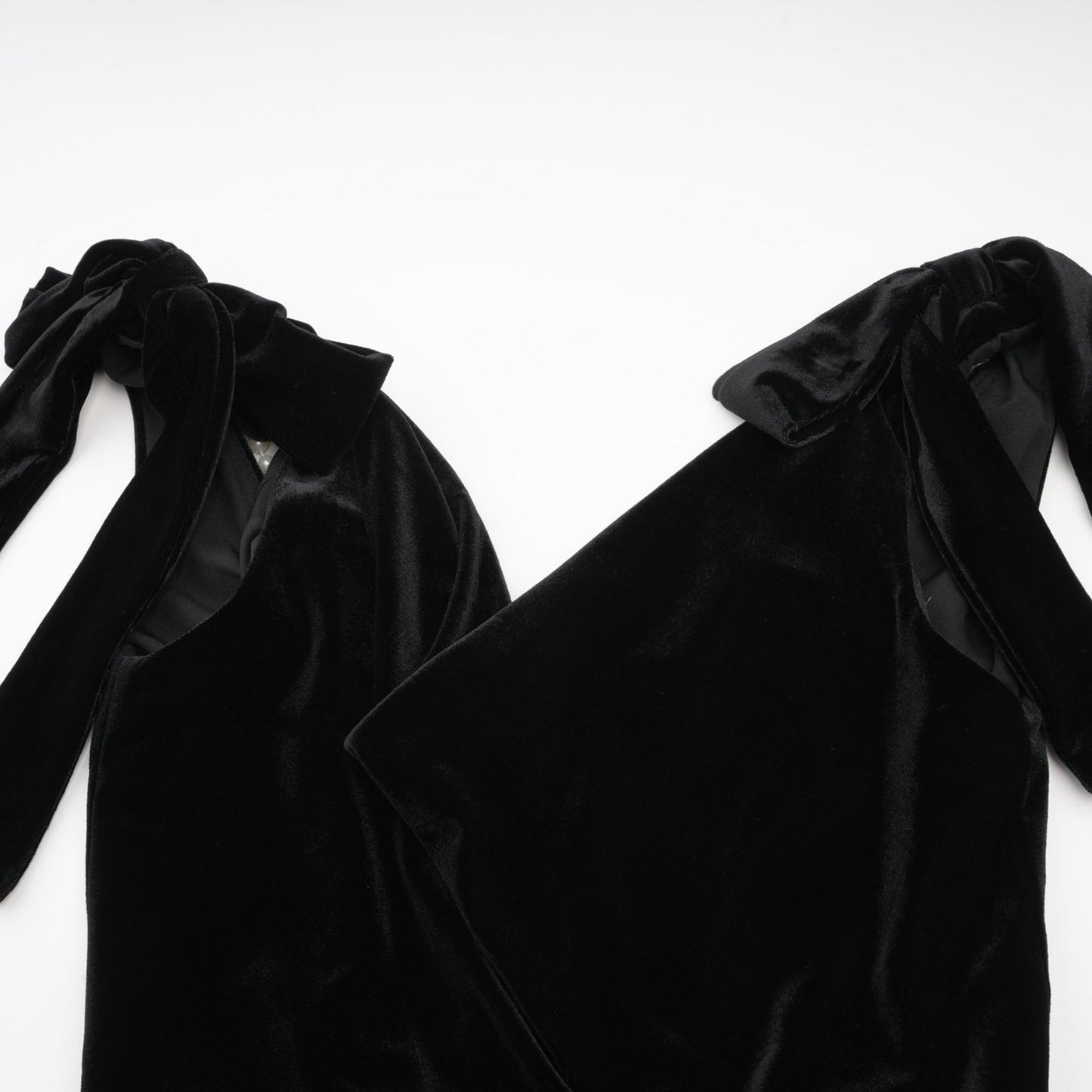 A long velvet maxi dress in dark color with an open back and embellished details named Audrey