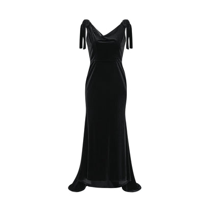 A long velvet maxi dress in dark color with embellishments and an open back design named Audrey