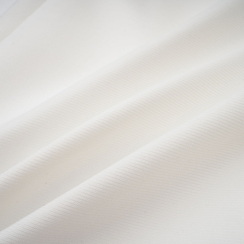 A long white bandage style maxi dress with floral applique details named Olivia