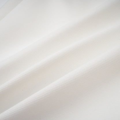 A long white bandage style maxi dress with floral applique details named Olivia