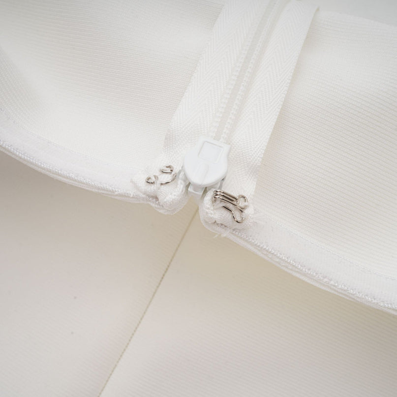 A long white bandage style maxi dress with floral applique details named Olivia