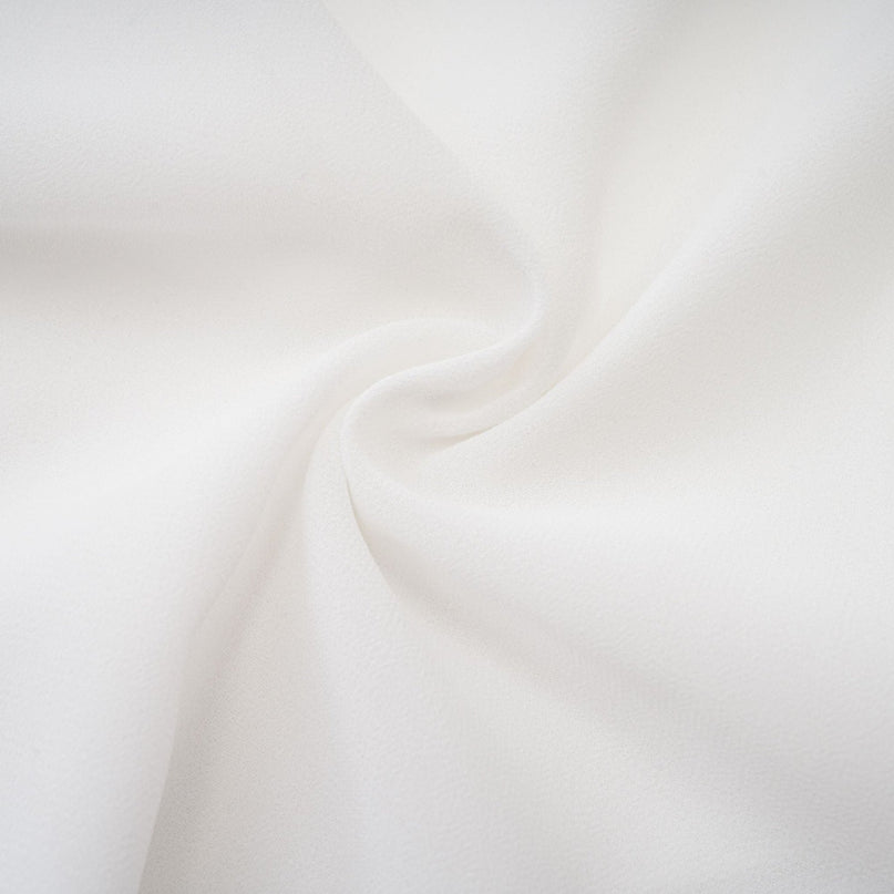 A long white chiffon maxi dress with a halter neck and ruffle details named Mariah