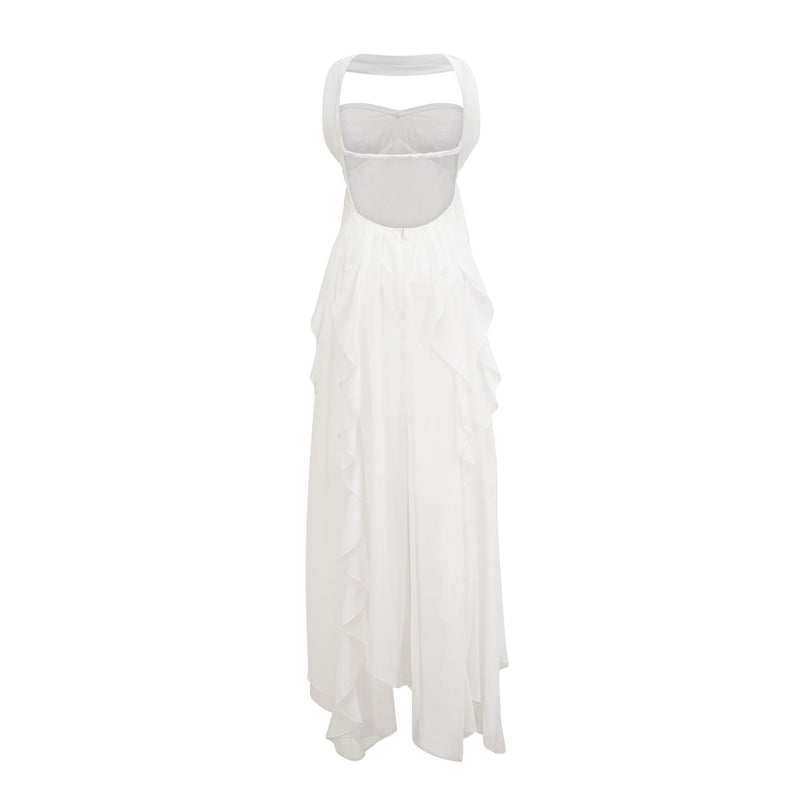 A long white chiffon maxi dress with a halter neckline and ruffled details worn by a model against a plain background