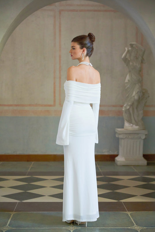 A long white knit dress with glittery floral appliques featuring Wanda design