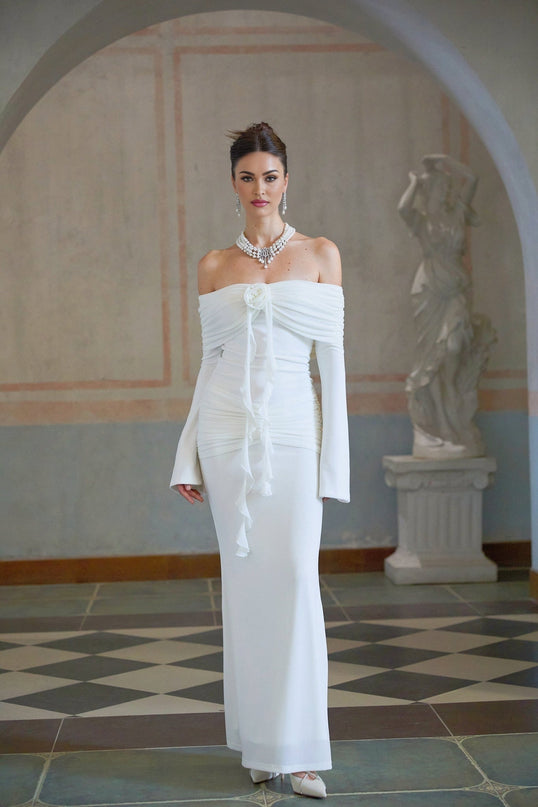 A long white knit maxi dress with glittered floral applique details named Wanda