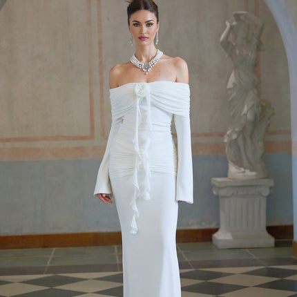 A long white knit maxi dress with glittery floral applique details named Wanda