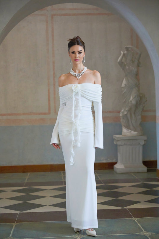 A long white knit maxi dress with glittery floral applique details named Wanda