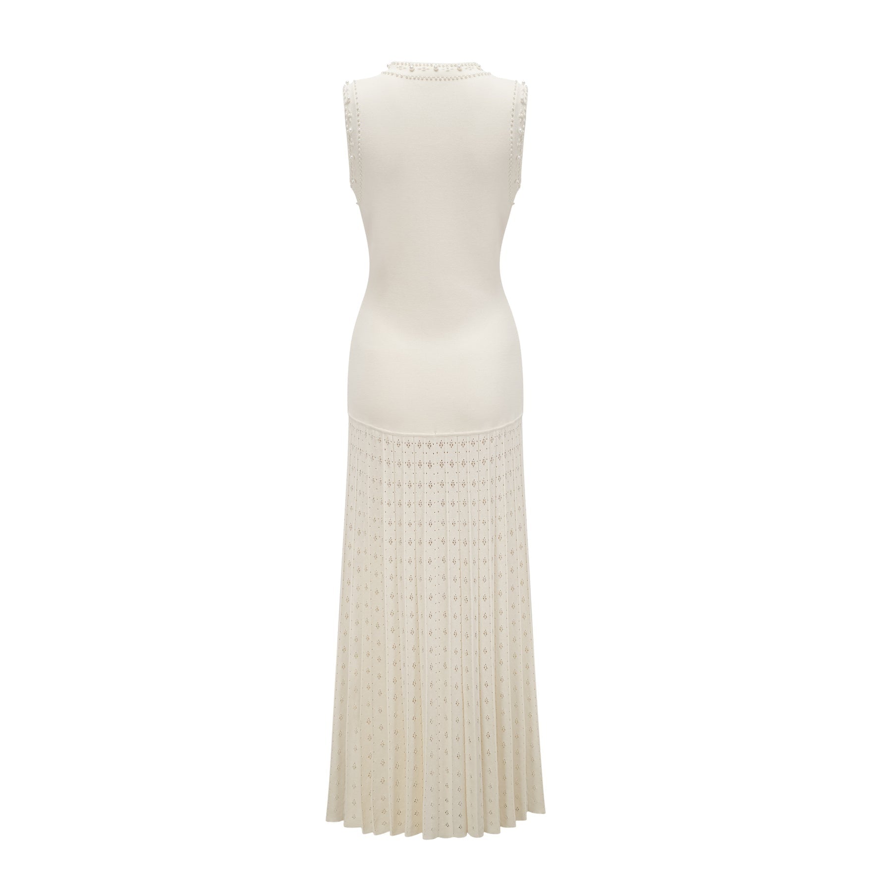 A long white knitted maxi dress with faux pearl embellishments throughout the fabric