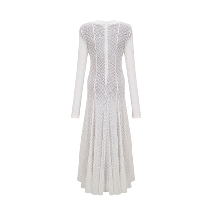A long white lace maxi dress with a wavy pattern design featuring a feminine silhouette and delicate details