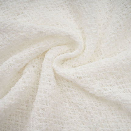 A long white lace maxi dress with a wavy pattern design named Athena