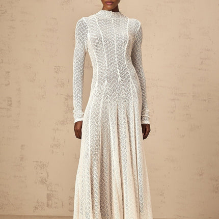 A long white lace maxi dress with a wavy pattern design named Athena