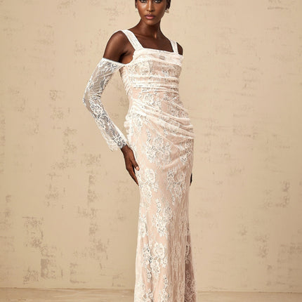 A long white maxi dress with a floral lace pattern featuring a corset style bodice with ruched detailing named Berenice