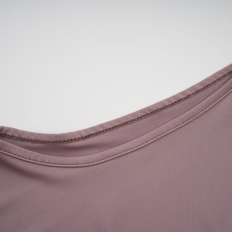 A long white maxi dress with a wavy lace pattern featuring a flowy silhouette and delicate details