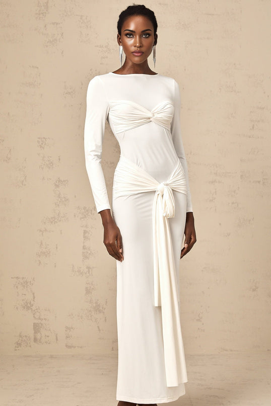 A long white maxi dress with ribbon twist detailing and ruched fabric featuring a sleeveless design and fitted silhouette