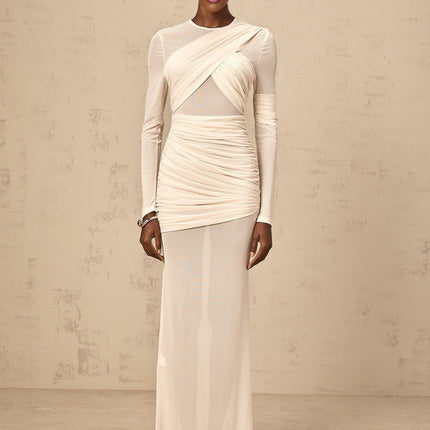 A long white maxi dress with ruched tulle fabric and a flowing silhouette