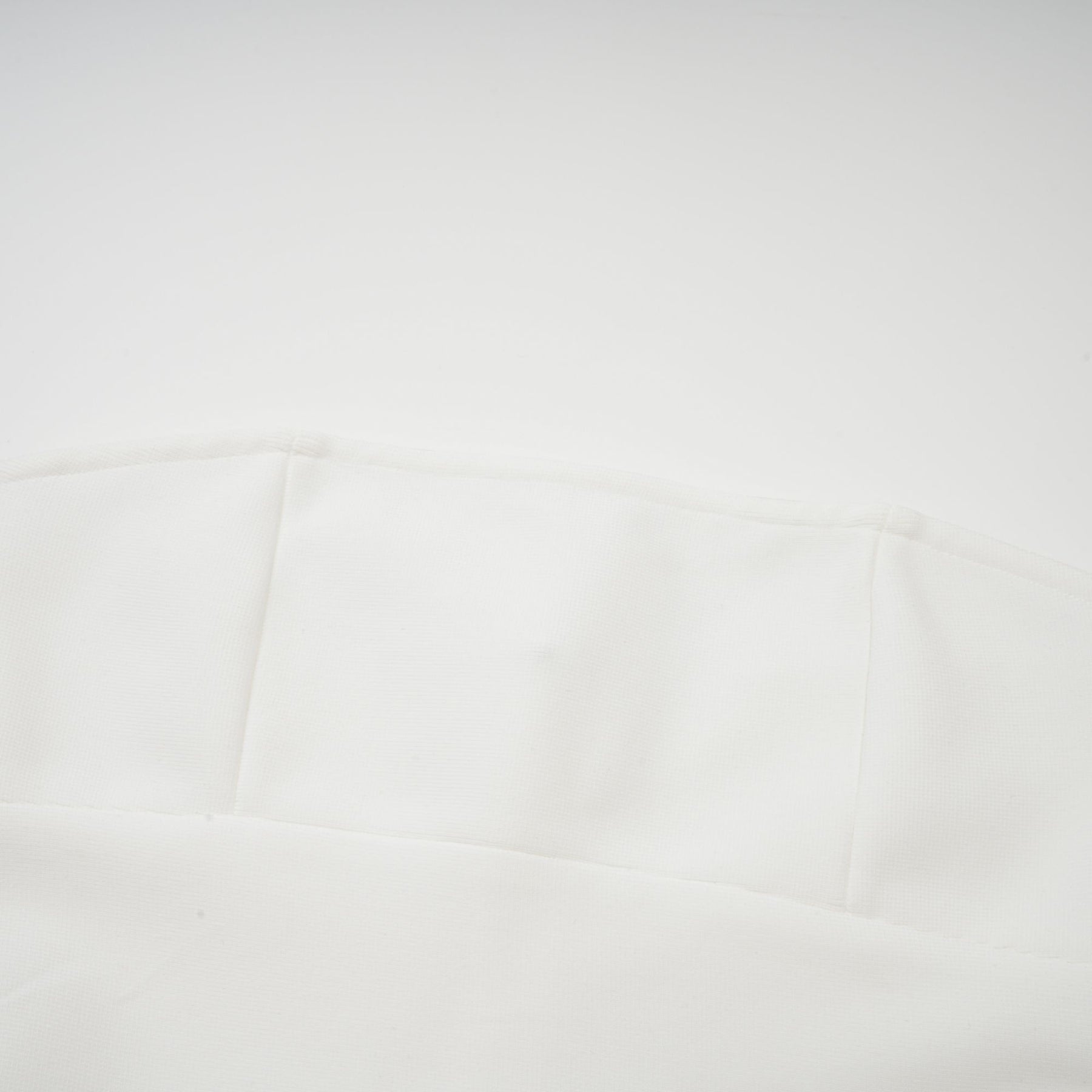 A long white maxi dress with tulle panelling named Nathalie featuring a flowy silhouette and delicate sheer details