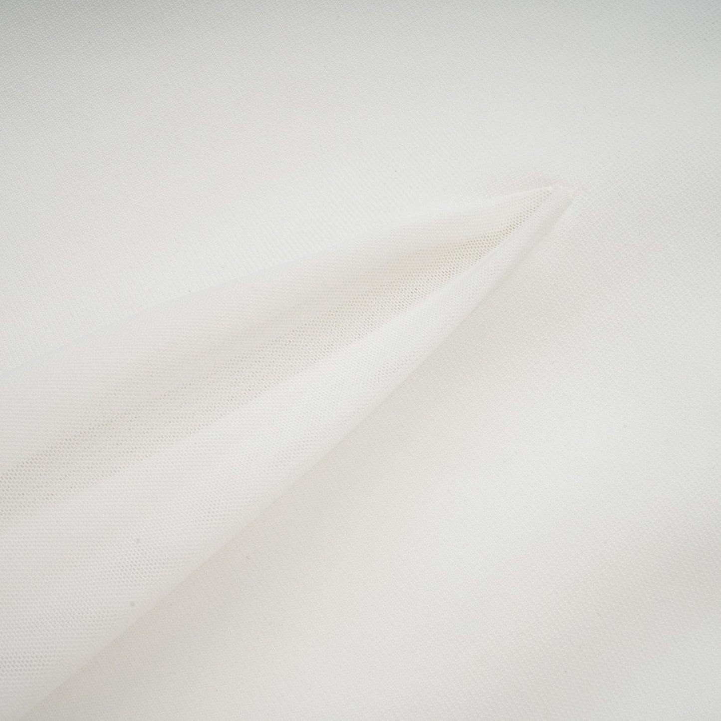 A long white maxi dress with tulle panelling named Nathalie featuring a flowy silhouette and delicate sheer details