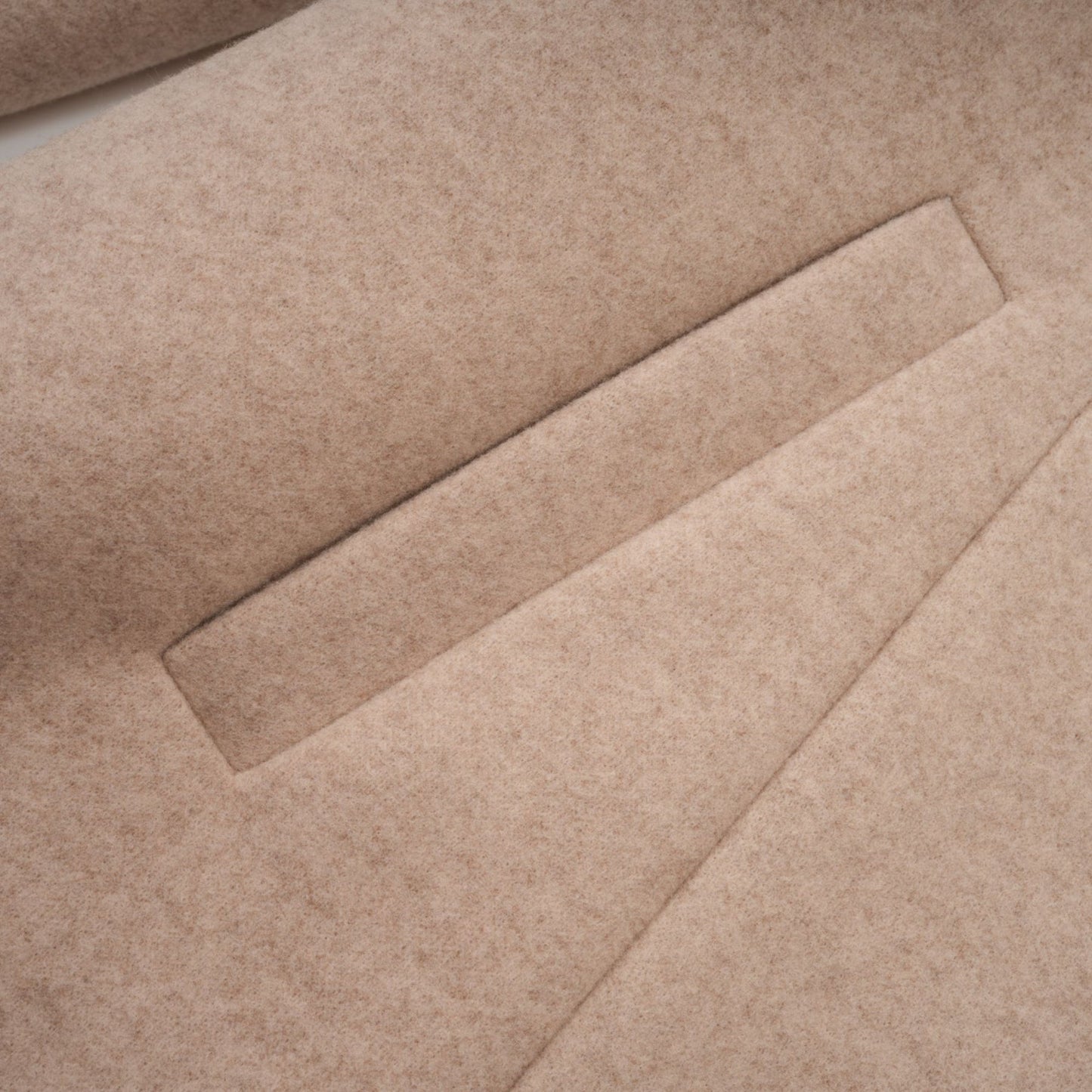 A long winter coat with a detachable cape made of faux fur in a rich rosella red color