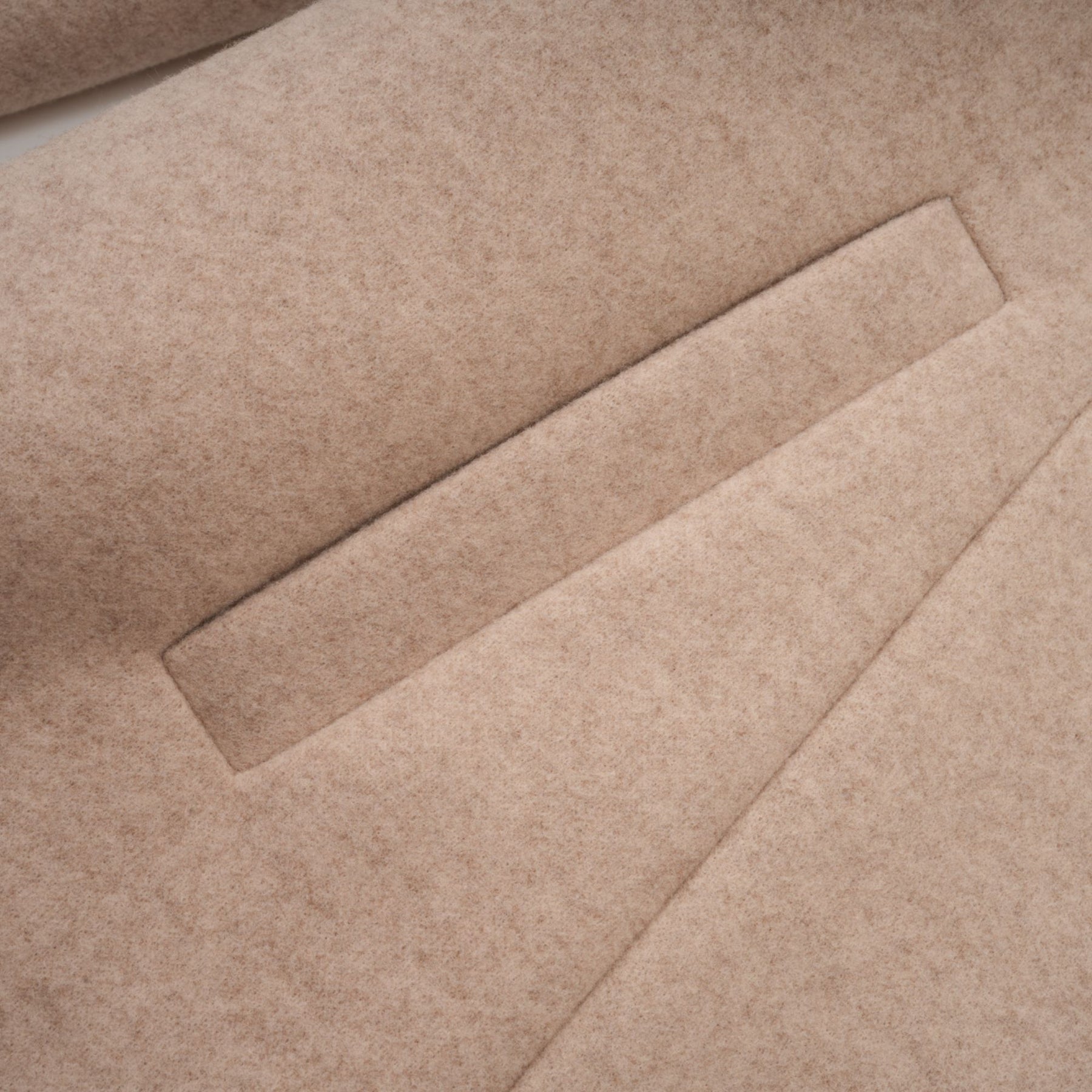 A long winter coat with a detachable cape made of faux fur in a rich rosella red color