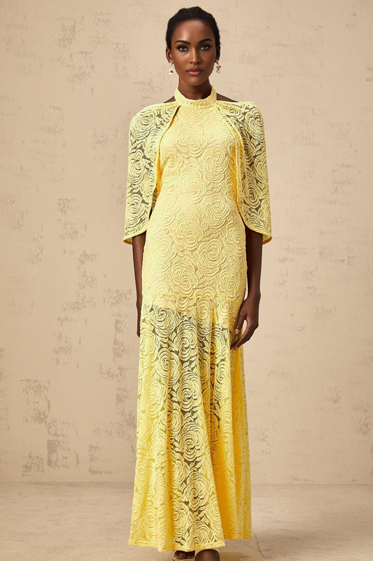 A long yellow maxi dress with a cape design made of delicate chantilly lace named Ursula