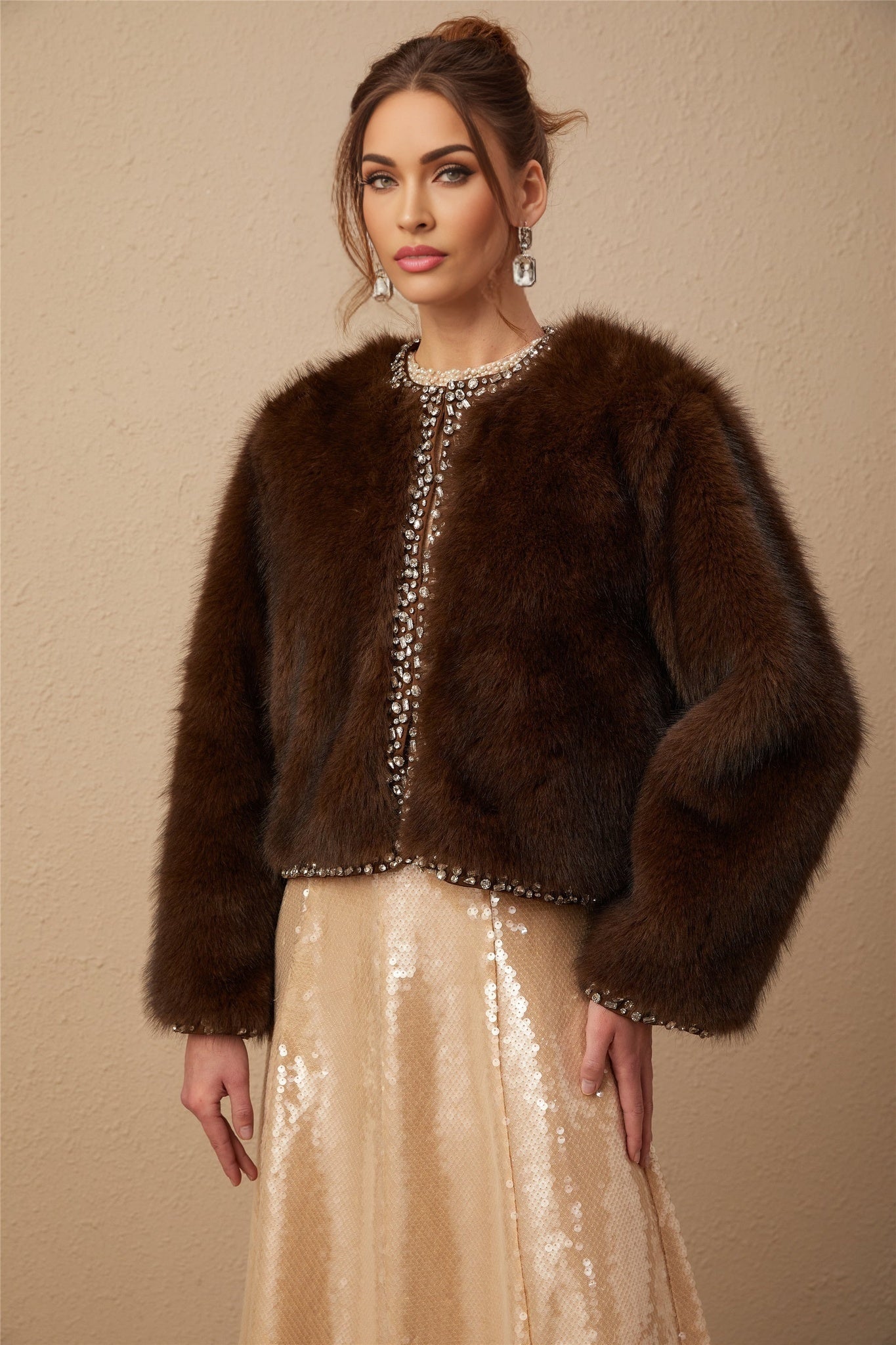 A luxurious ombre crystal faux fur coat in shades of blue and white with a gradient effect from dark to light