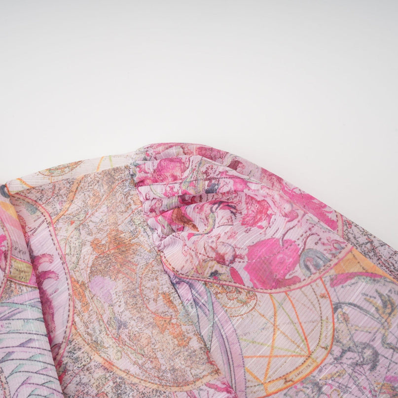 A matching set consisting of a cherry pink shirt and skirt with a pattern print design