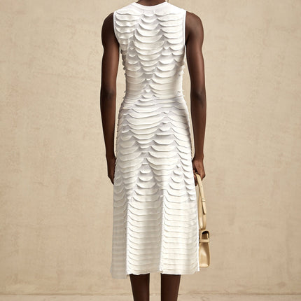 A midi dress with a snake pattern design featuring a godet skirt silhouette called Anna