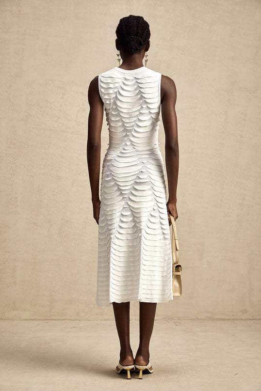 A midi dress with a snake pattern design featuring a godet skirt silhouette called Anna