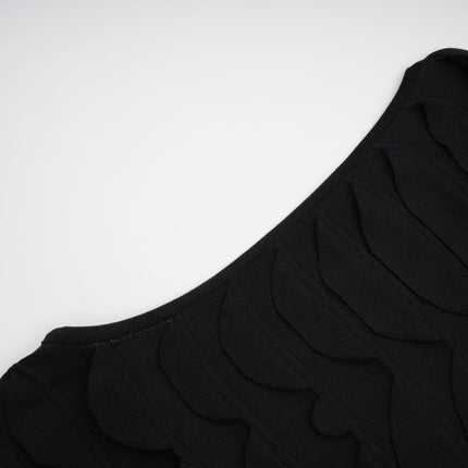 A midi dress with a snake pattern design featuring a godet skirt silhouette called Anna