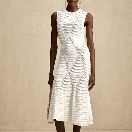 A midi dress with a snake pattern design featuring a godet skirt silhouette called Anna