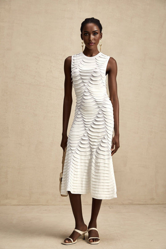 A midi dress with a snake pattern design featuring a godet skirt silhouette called Anna