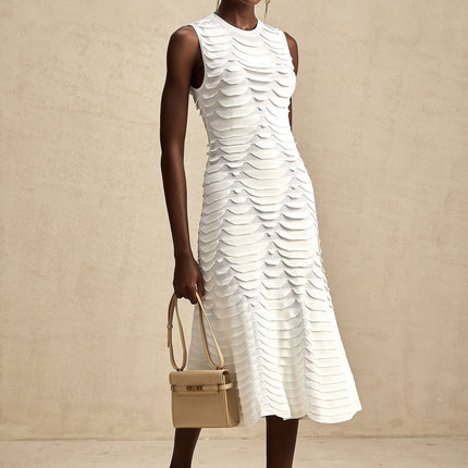 A midi dress with a snake pattern featuring a godet skirt design named Anna
