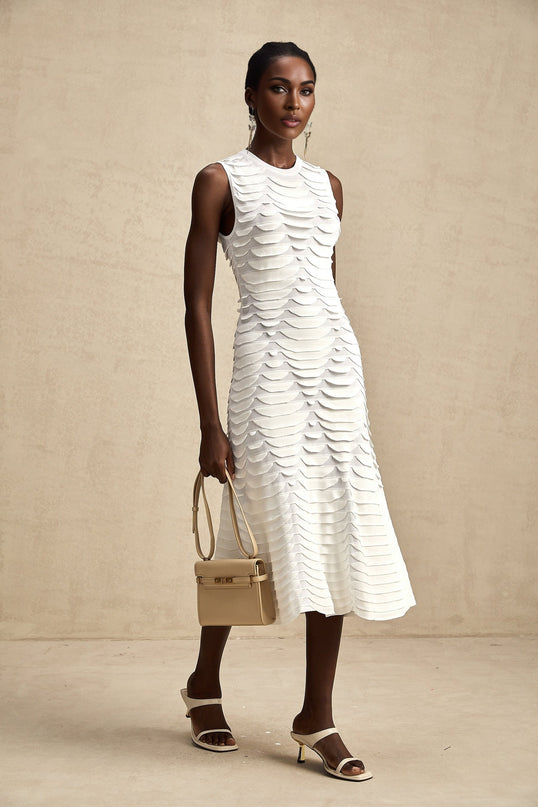 A midi dress with a snake pattern featuring a godet skirt design named Anna