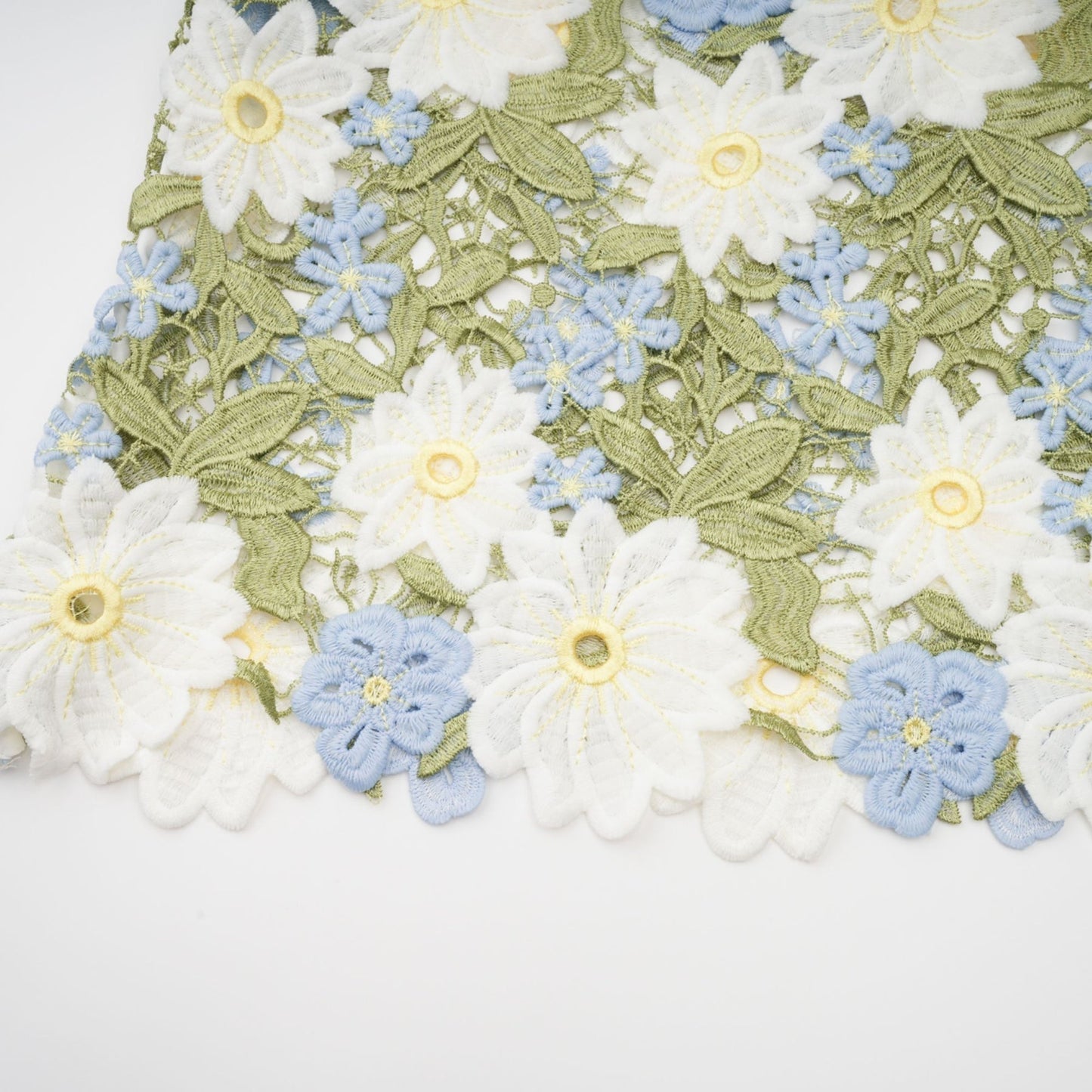 A midi dress with floral embroidery and hollow carved details named Carla featuring a delicate pattern and feminine silhouette