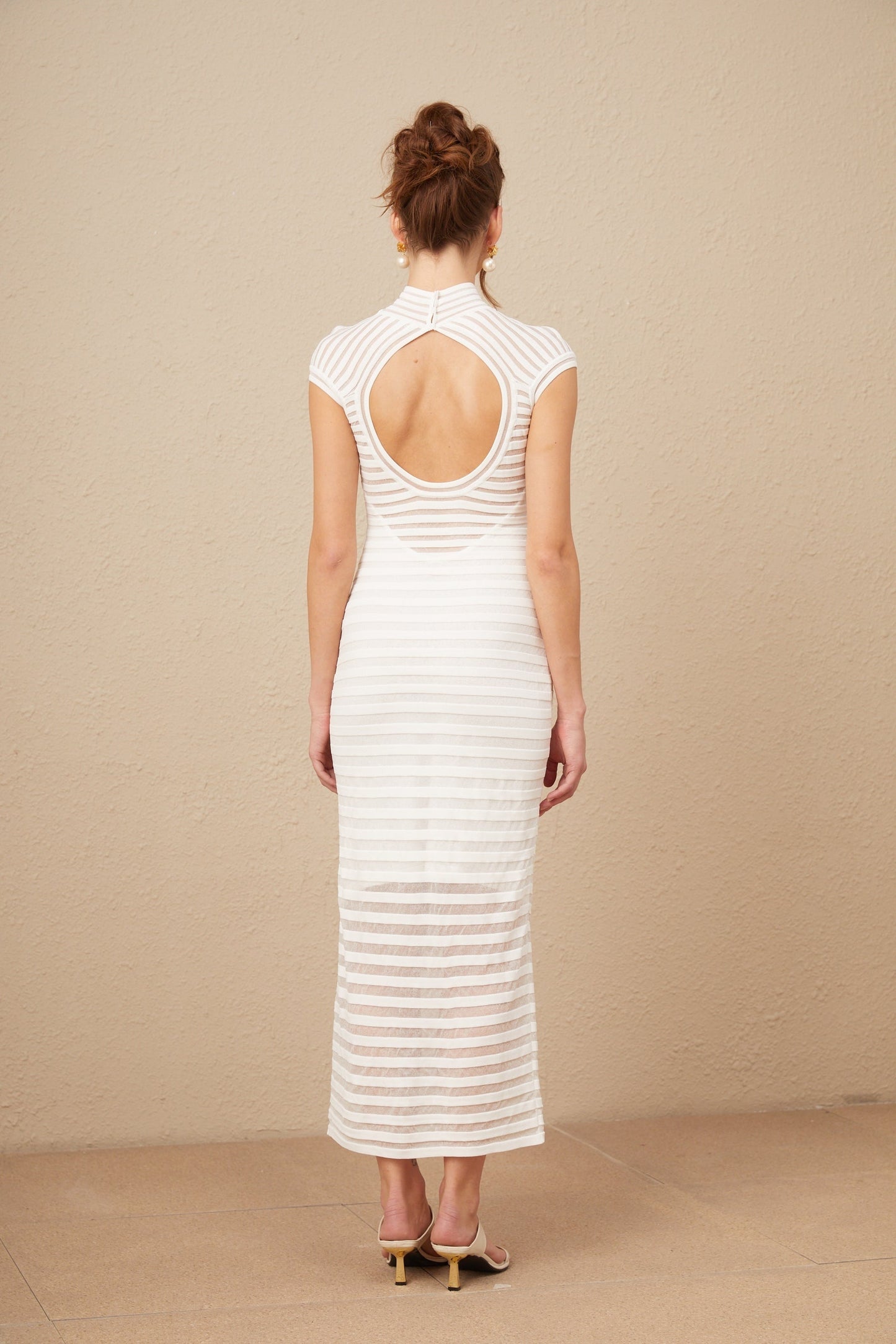 A midi dress with horizontal stripes in tulle fabric featuring a design inspired by the Josephine style