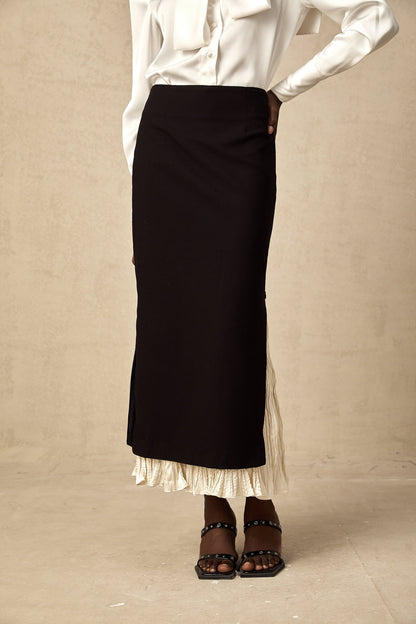 A midi skirt with colorblocked panels in different shades featuring a panelled design and falling to mid calf length