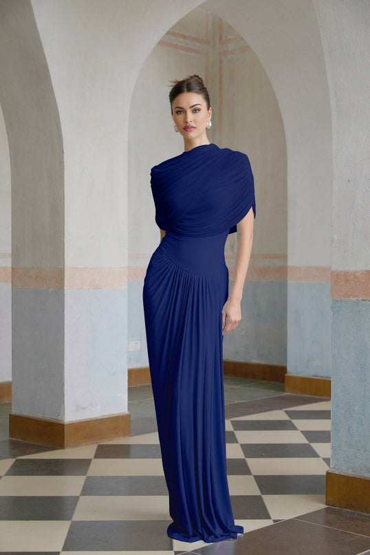 A navy blue maxi dress with an asymmetric design and pleated details featuring a long flowing skirt and elegant silhouette