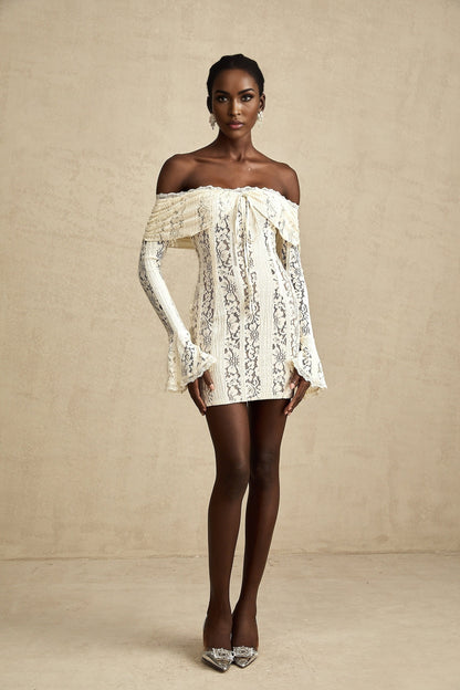 A neutral colored mini dress with floral lace pattern and flared cuffs named Émeline