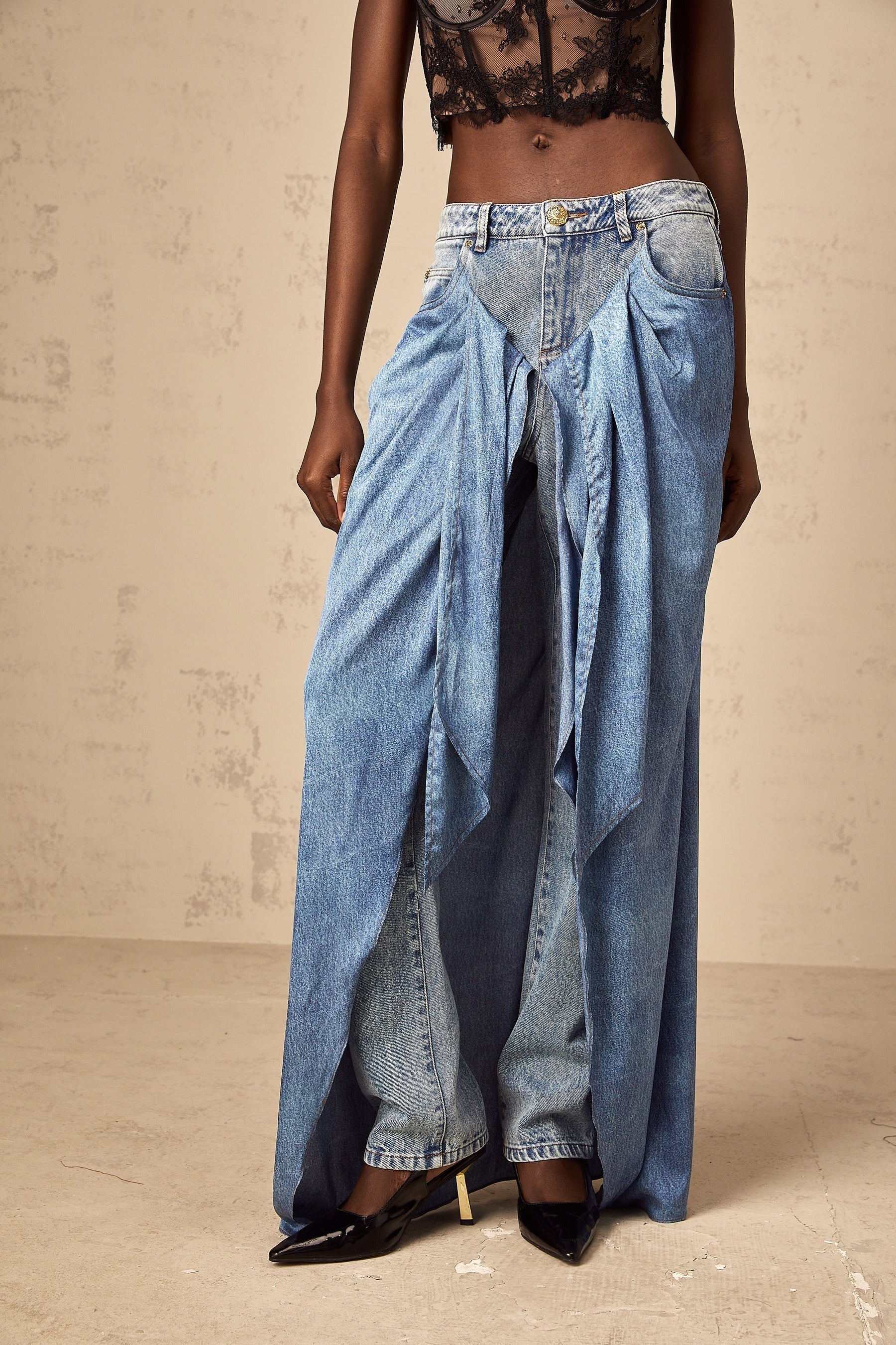 A pair of blue layered denim jeans named Ysabella featuring a stylish multitiered design