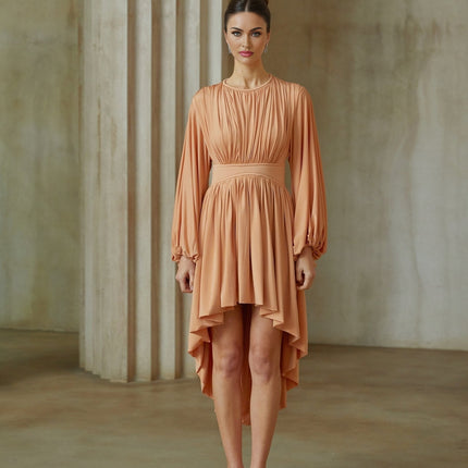 A pink asymmetrical midi dress with pleated details featuring a sleeveless design and a flowy silhouette