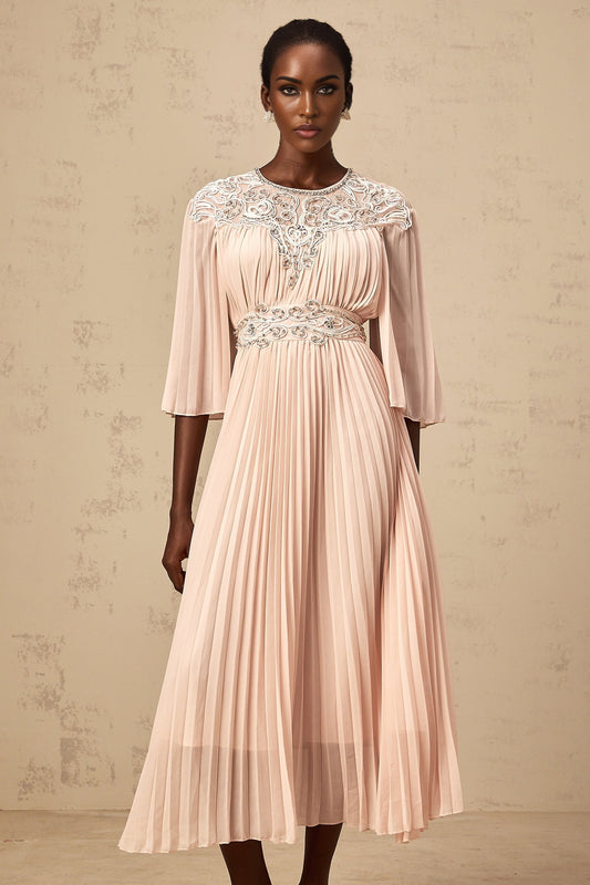 A pink crystal embellished midi dress with full pleats and a flowing silhouette