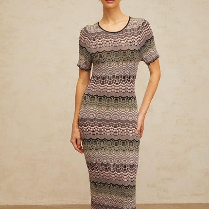 A pink maxi dress with a wavy crochet knit pattern and long sleeves