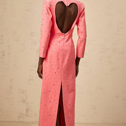 A pink maxi dress with heart shaped cutouts and embellishments named Zelie