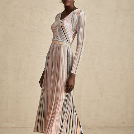 A pink metallic midi dress with pleated design named Mathilde featuring a shimmering finish and midlength hemline