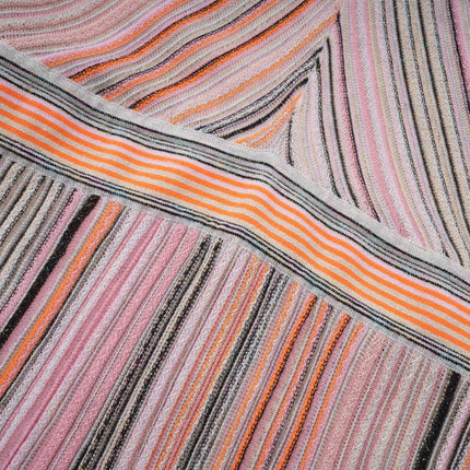 A pink metallic pleated midi dress with a flowy skirt and feminine silhouette named Mathilde