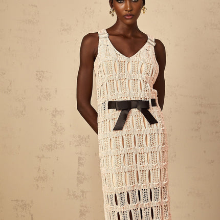 A pink midi dress with a crochet knit pattern featuring a bowknot detail named Elodie