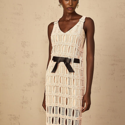 A pink midi dress with a crochet knit pattern featuring a bowknot detail named Elodie